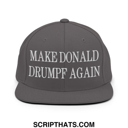 Dark gray snapback hat with white embroidered make Donald Drumpf again text and flat bill brim design