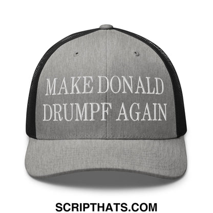 Gray trucker hat with black mesh back and white embroidered make donald drumpf again text on front