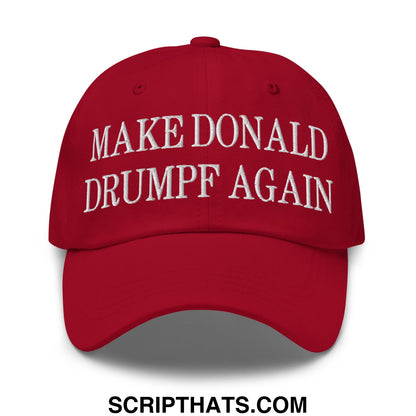 Red unstructured dad hat with white embroidered text reading make Donald Drumpf again for casual wear