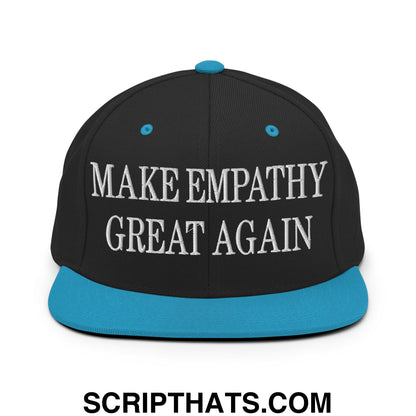 Black snapback cap with teal brim and white embroidered text make empathy great again on front panel