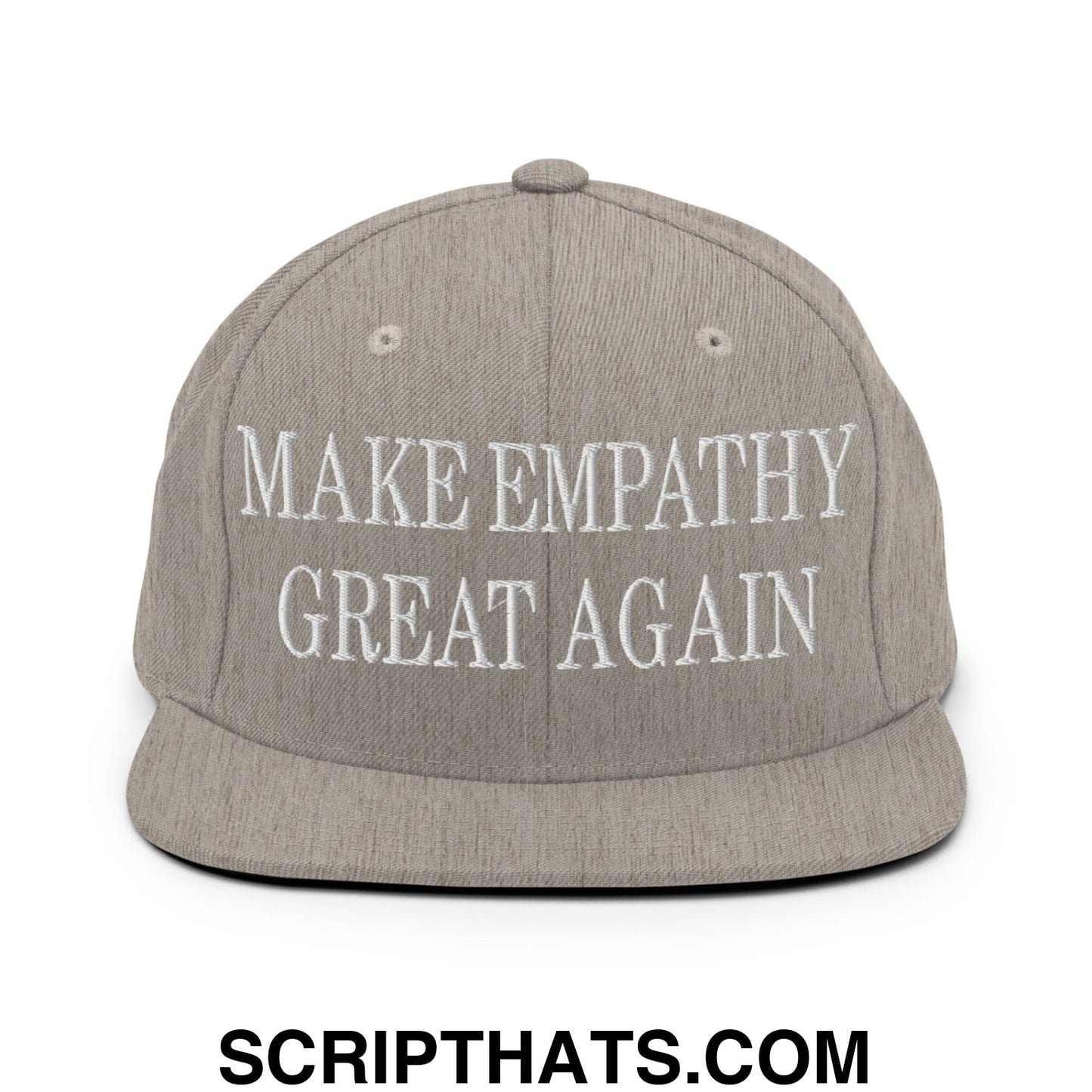 A gray snapback hat with white embroidered text reading make empathy great again flat bill brim design