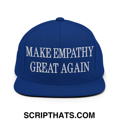 Royal blue snapback hat with white embroidered make empathy great again text and flat bill brim design