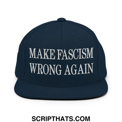 Navy blue snapback hat with white embroidered flat bill brim featuring make fascism wrong again text