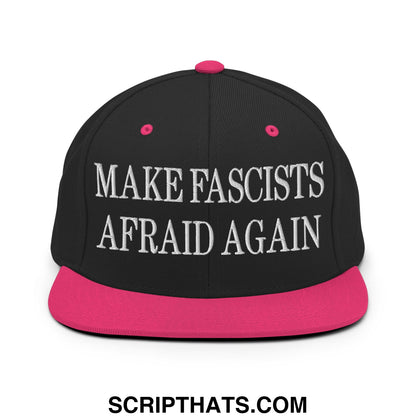 Black snapback cap with vibrant pink brim and button featuring bold white embroidered text make fascists afraid again