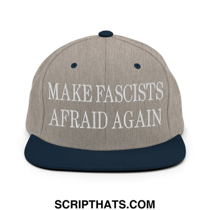 Gray and navy blue snapback hat with white embroidered text make fascists afraid again on the front panel
