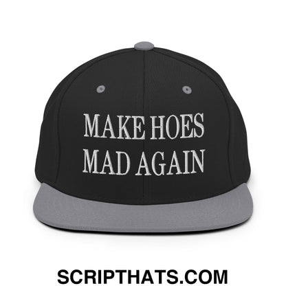 Black snapback cap with gray brim and white embroidered make hoes mad again text in bold serif font