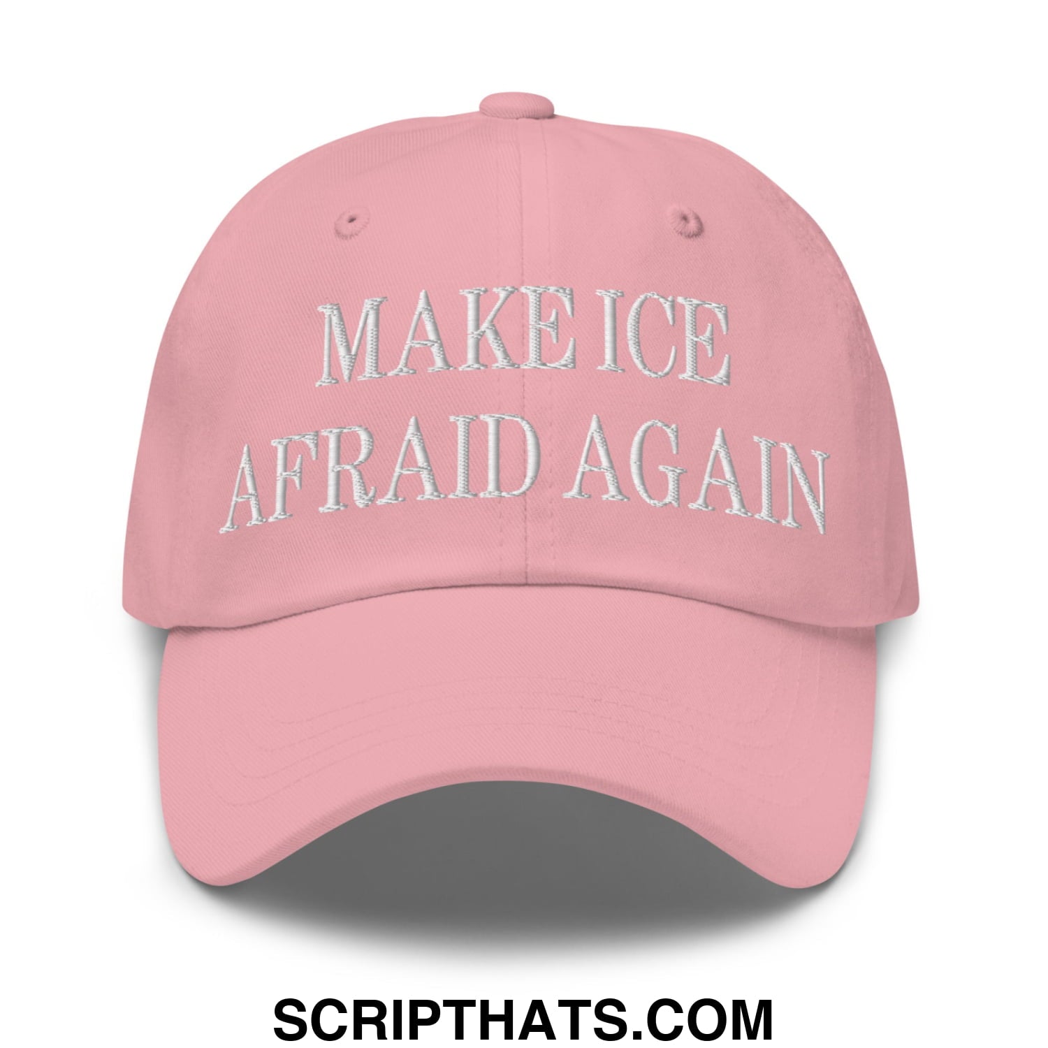 A soft pink unstructured dad hat with white embroidered make ice afraid again text on the front