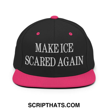 Black snapback cap with vibrant pink flat bill brim and pink button featuring white embroidered make ice scared again text