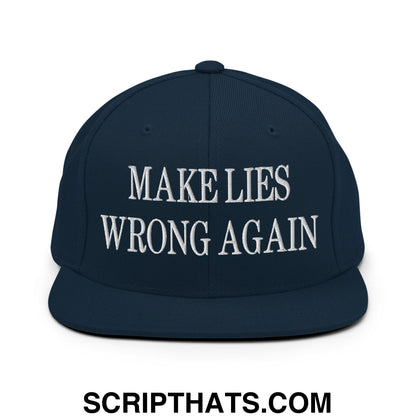 Navy blue snapback hat with white embroidered make lies wrong again text and flat bill brim design