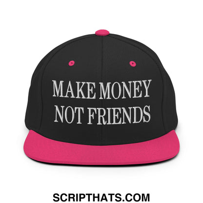 Black snapback cap with vibrant pink flat bill brim and button featuring white embroidered make money not friends text