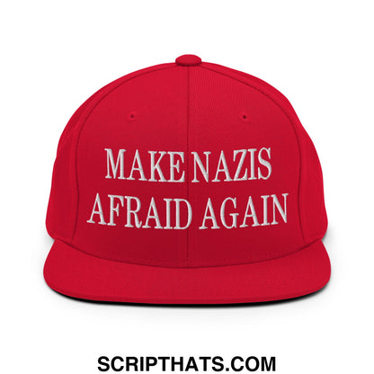 Red snapback cap with white embroidered text make nazis afraid again featuring a flat bill brim design