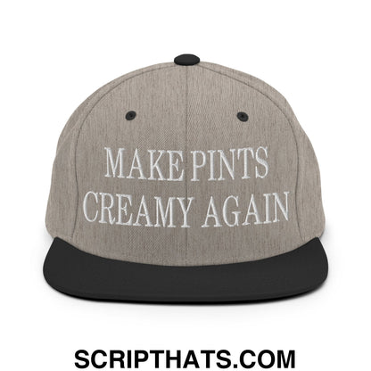 Gray snapback hat with black brim and embroidered white text make pints creamy again on the front panel