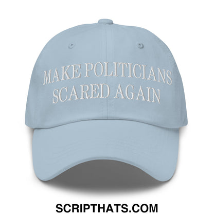 Light blue embroidered unstructured dad hat with white text reading make politicians scared again