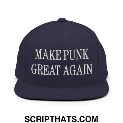 Navy blue snapback hat with white embroidered make punk great again text and a flat bill brim design