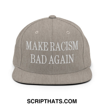 Gray snapback hat with white embroidered text reading make racism bad again on a flat bill brim design