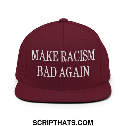 Maroon snapback cap with white embroidered text reading make racism bad again flat bill brim design