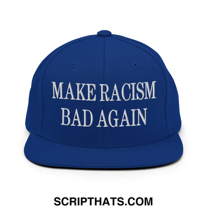 Royal blue snapback cap with white embroidered make racism bad again text and flat bill brim