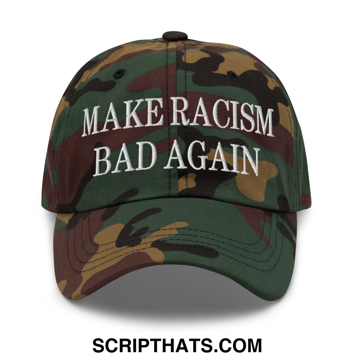 A camouflage unstructured dad hat with white embroidered text reading make racism bad again
