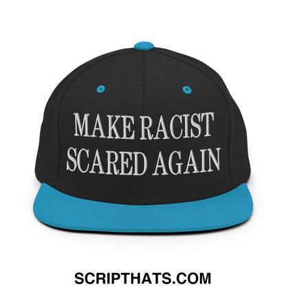 Black snapback cap with teal brim and button featuring white embroidered text make racist scared again