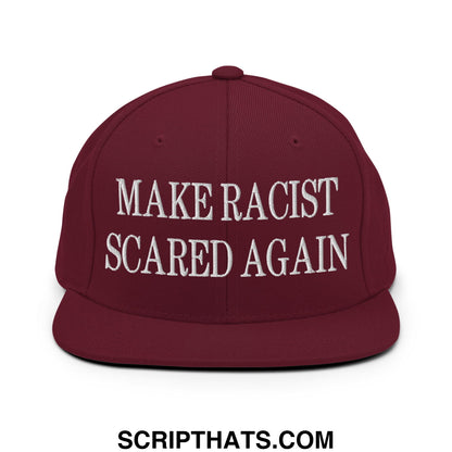 Maroon snapback cap with white embroidered text make racist scared again featuring a flat bill brim design