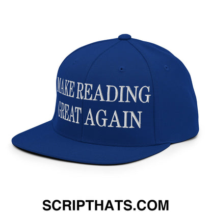 A royal blue snapback hat with white embroidered make reading great again text on the front flat bill brim