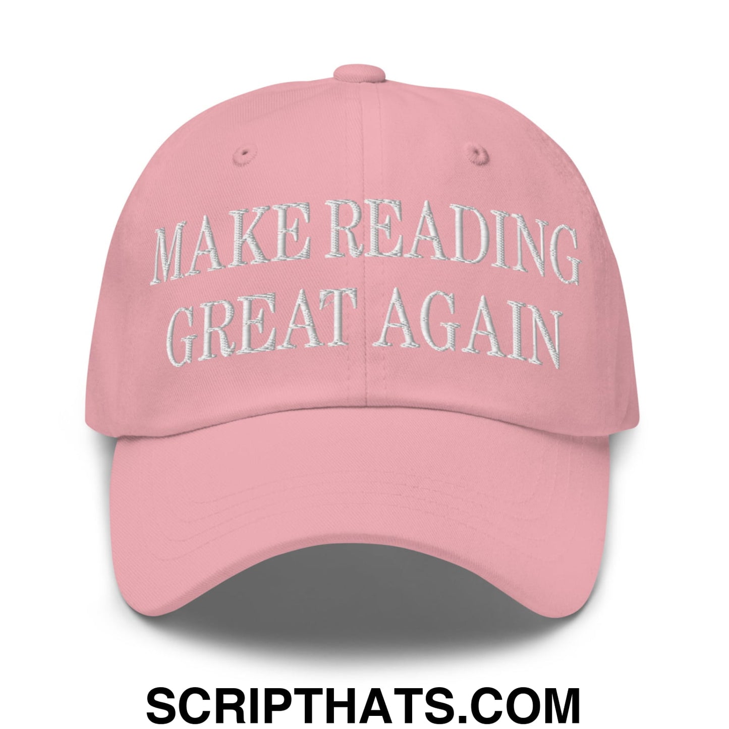 A soft pink unstructured dad hat with make reading great again embroidered in white thread on the front