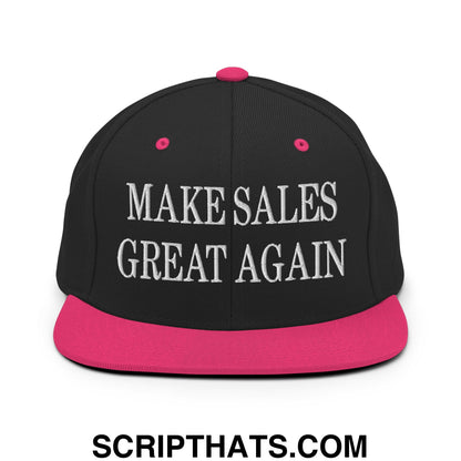 Black snapback cap with vibrant pink brim and button featuring white embroidered make sales great again text
