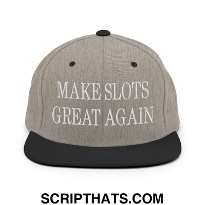 Gray snapback hat with black flat bill brim and embroidered white text reading make slots great again