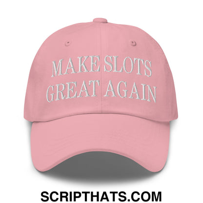 A soft pink unstructured dad hat with make slots great again embroidered in white thread on the front