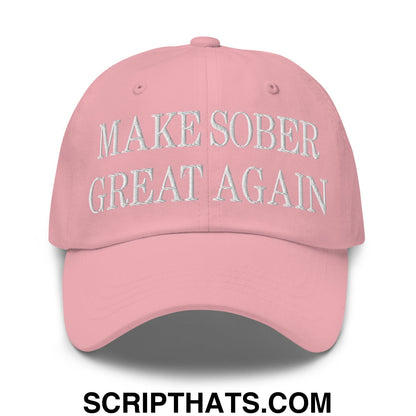A soft pink embroidered unstructured dad hat with make sober great again text on the front in white thread