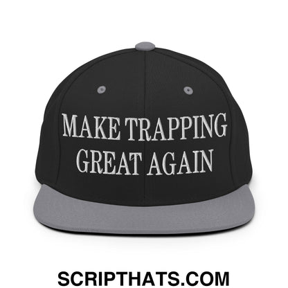 Black snapback cap with gray brim and white embroidered make trapping great again text on front panel