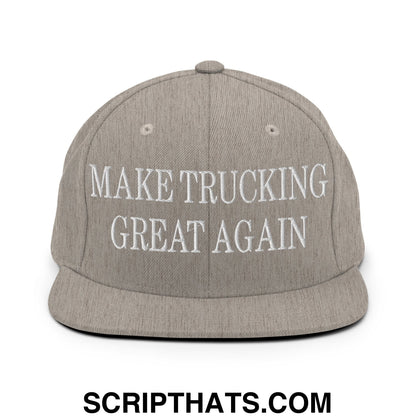 Gray embroidered flat bill snapback hat with white text reading make trucking great again for trucking enthusiasts