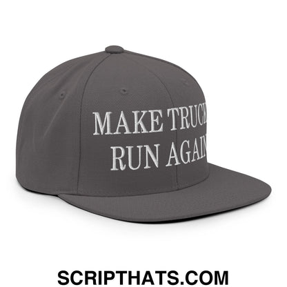 Gray snapback cap with white embroidered text make truck run again and a flat bill brim design