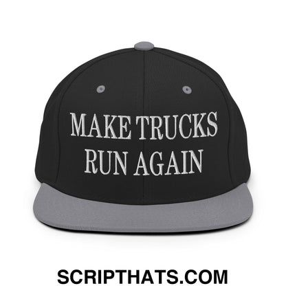 Black snapback cap with gray brim and white embroidered text make trucks run again flat bill brim design