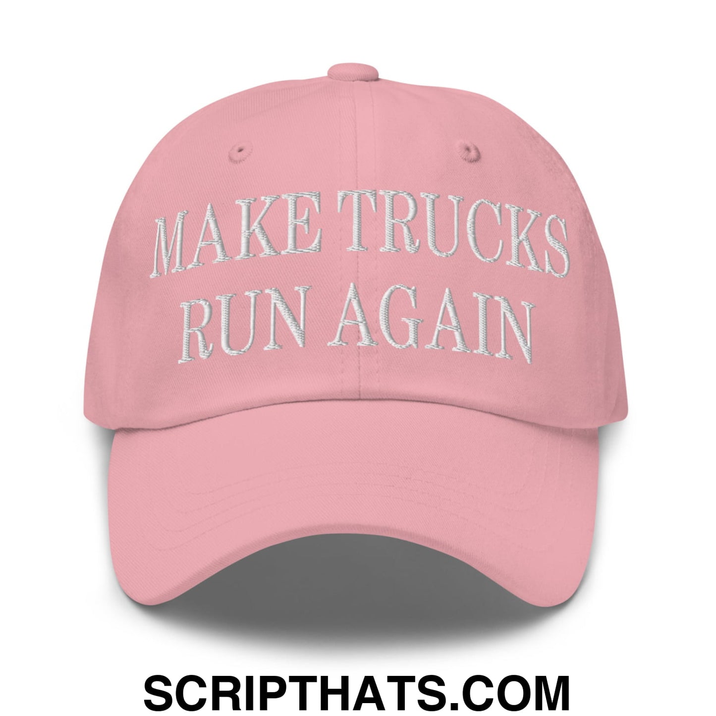 A soft pink unstructured dad hat with white embroidered make trucks run again text on the front