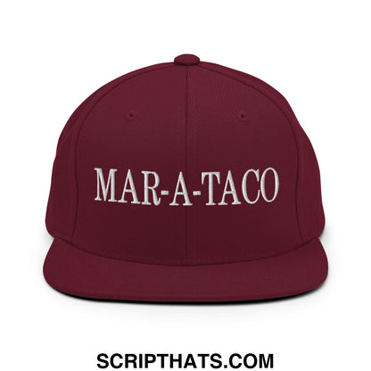 Maroon snapback hat with white embroidered mar-a-taco text and flat bill brim for casual wear