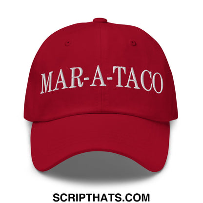 Red unstructured dad hat with white embroidered mar-a-taco text on the front made of soft cotton material