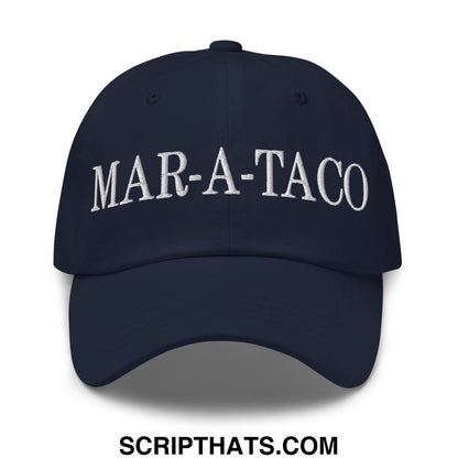 Navy blue unstructured dad hat with white embroidered mar-a-taco text across the front