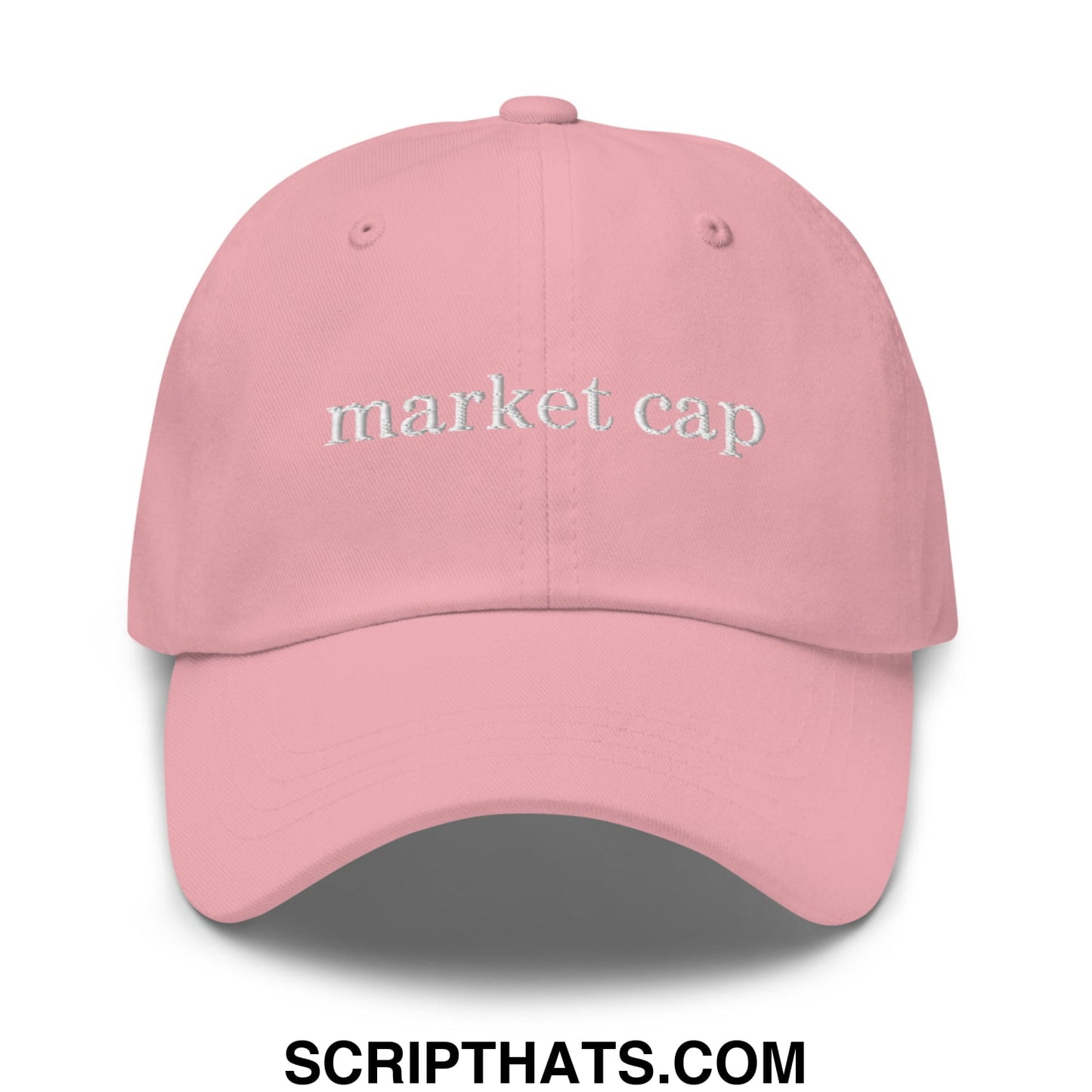 A soft pink unstructured dad hat with market cap embroidered in white thread across the front