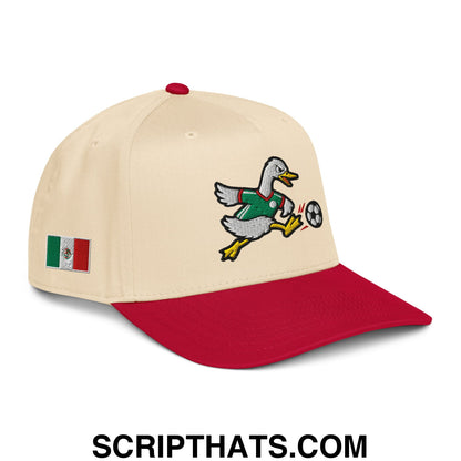 Beige and red baseball snapback hat with embroidered duck in green jersey kicking soccer ball and mexican flag patch