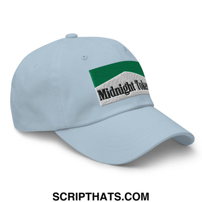Light blue unstructured dad hat with green and white embroidered midnight token patch for casual wear