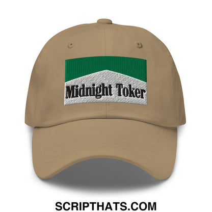 Tan unstructured dad hat with midnight toker black lettering and green silver embroidered patch detail