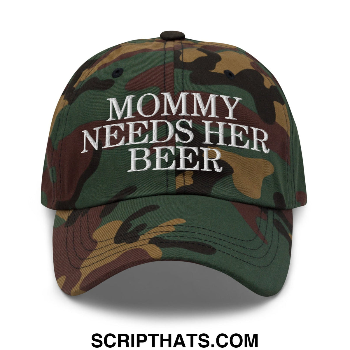 A camouflage unstructured dad hat with white embroidered text mommy needs her beer on the front panel