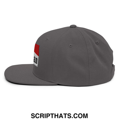 Gray snapback hat with a flat bill and red white patch featuring black embroidered text from mulligan cigarette collection