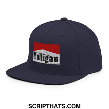 Navy blue snapback hat with a red and white embroidered mulligan logo patch and flat bill brim
