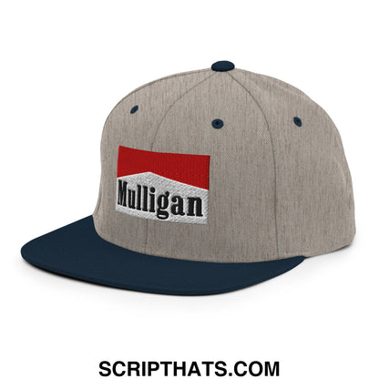 Gray and navy blue snapback cap with red and white embroidered mulligan cigarette logo on flat bill brim
