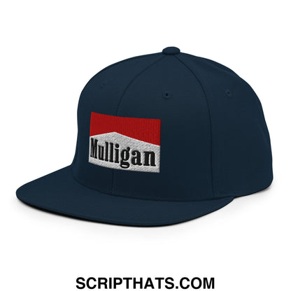 Dark blue snapback cap with red and white Mulligan cigarette embroidered flat bill brim logo and black lettering