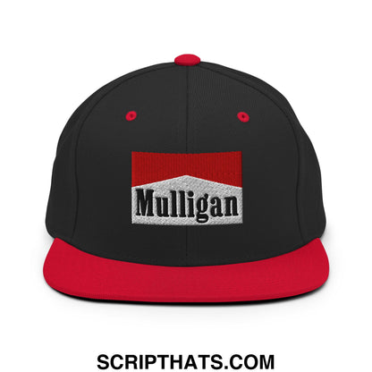 Black snapback cap with red flat bill and embroidered red white mulligan logo on front panel