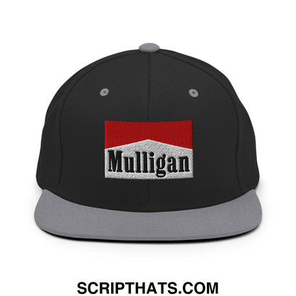 Black snapback cap with gray bill and red and white embroidered mulligan logo flat brim hat