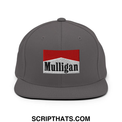 Gray snapback cap with a red and white embroidered mulligan cigarette logo and black lettering on a flat bill brim